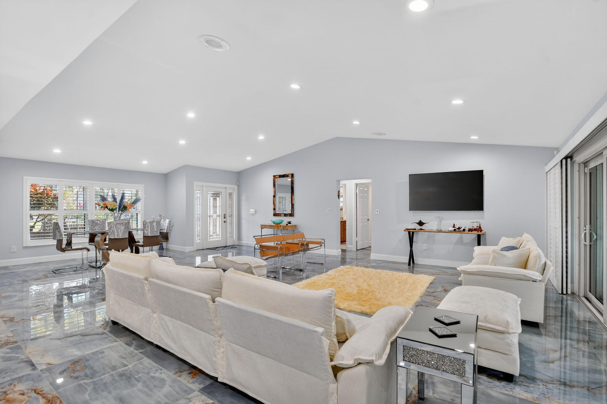 10294 Crosswind Road Boca Raton, FL 33498 - Photo 10 of 71 a living room with furniture and a flat screen tv