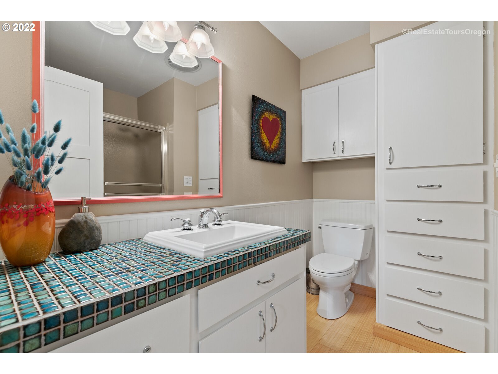 9125 Southwest Rambler Lane Portland, OR 97223 - Photo 20 of 32 a bathroom with a granite countertop sink mirror vanity and toilet