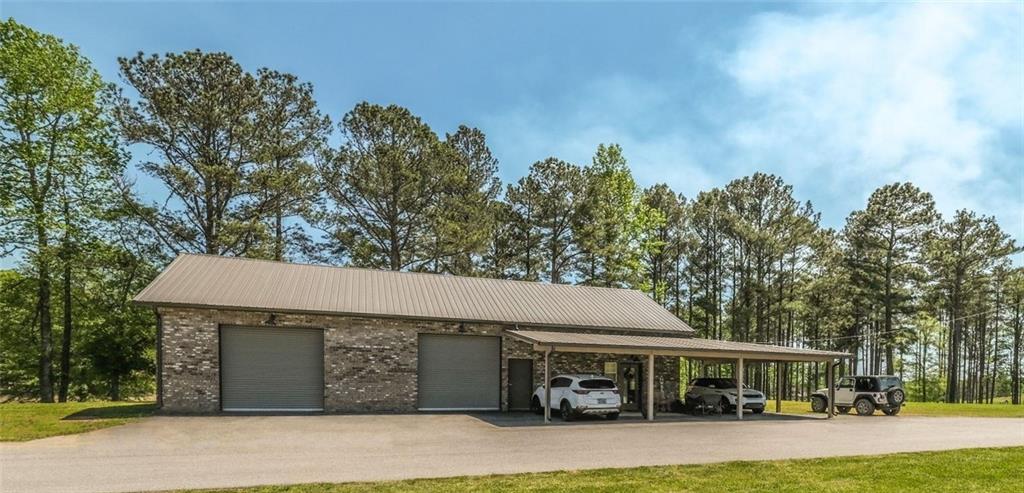 1600 Happy Hollow Road Roopville, GA 30170 - Photo 11 of 41 a front view of a house with garden