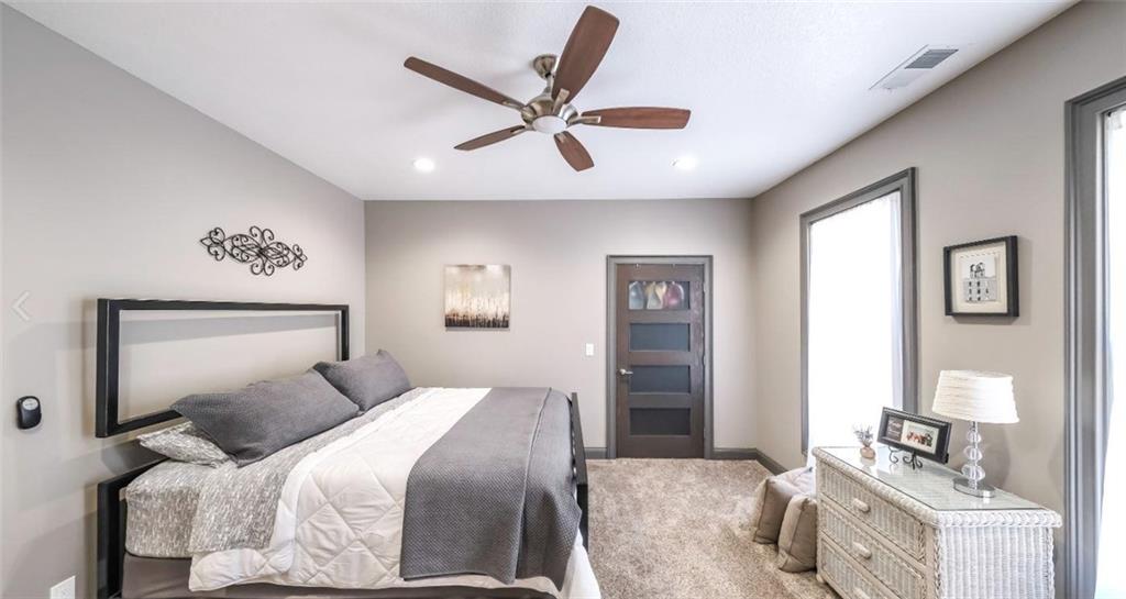 1600 Happy Hollow Road Roopville, GA 30170 - Photo 12 of 41 a bedroom with a large bed and ceiling fan