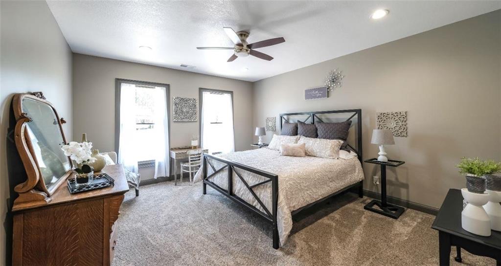 1600 Happy Hollow Road Roopville, GA 30170 - Photo 16 of 41 a bed room with furniture and a window