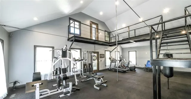a view of a livingroom with furniture and staircase
