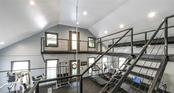 a kitchen with stainless steel appliances kitchen island granite countertop a sink and cabinets