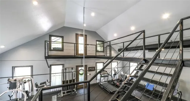 a kitchen with stainless steel appliances kitchen island granite countertop a sink and cabinets