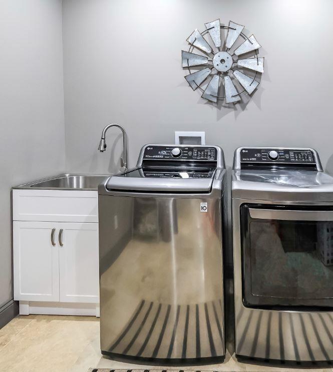 1600 Happy Hollow Road Roopville, GA 30170 - Photo 24 of 41 a view of a kitchen with a stove wooden floor and a chandelier