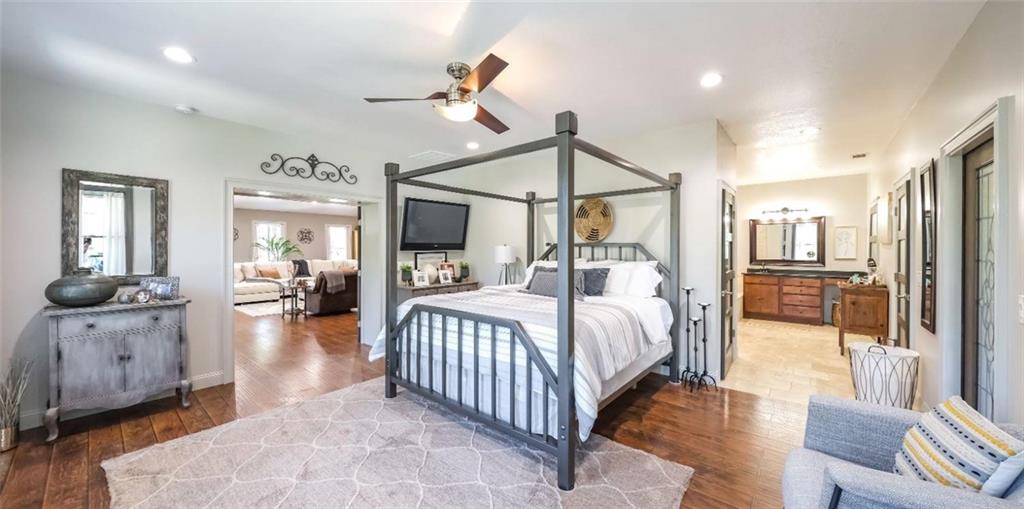 1600 Happy Hollow Road Roopville, GA 30170 - Photo 31 of 41 a bedroom with bed and a chandelier