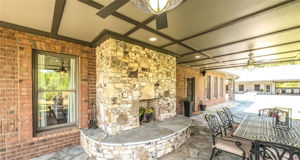 1600 Happy Hollow Road Roopville, GA 30170 - Photo 33 of 41 a dining room with furniture and a floor to ceiling window