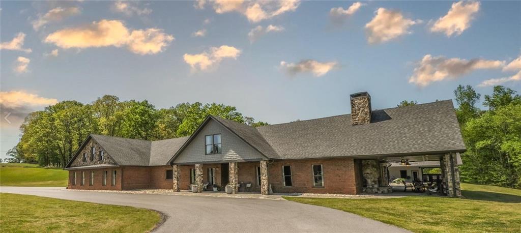 1600 Happy Hollow Road Roopville, GA 30170 - Photo 9 of 41 a front view of a house with garden