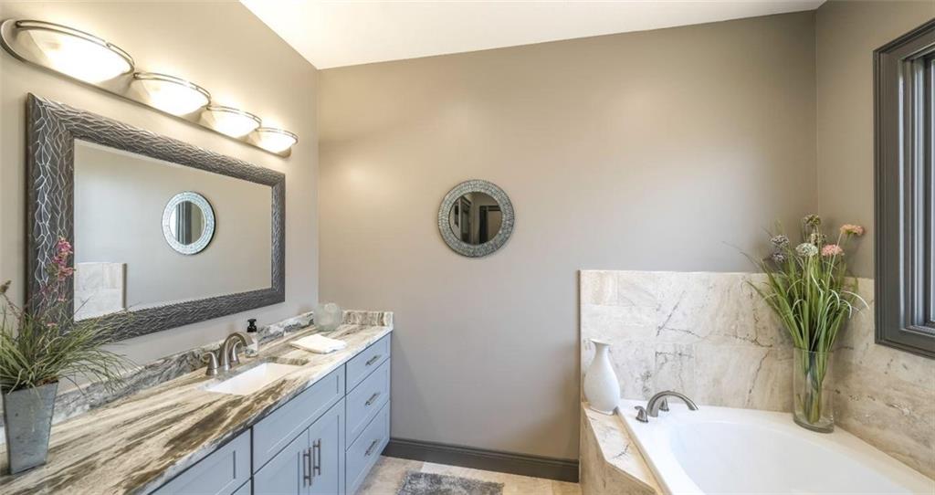 1600 Happy Hollow Road Roopville, GA 30170 - Photo 10 of 41 a bathroom with a granite countertop sink and a mirror