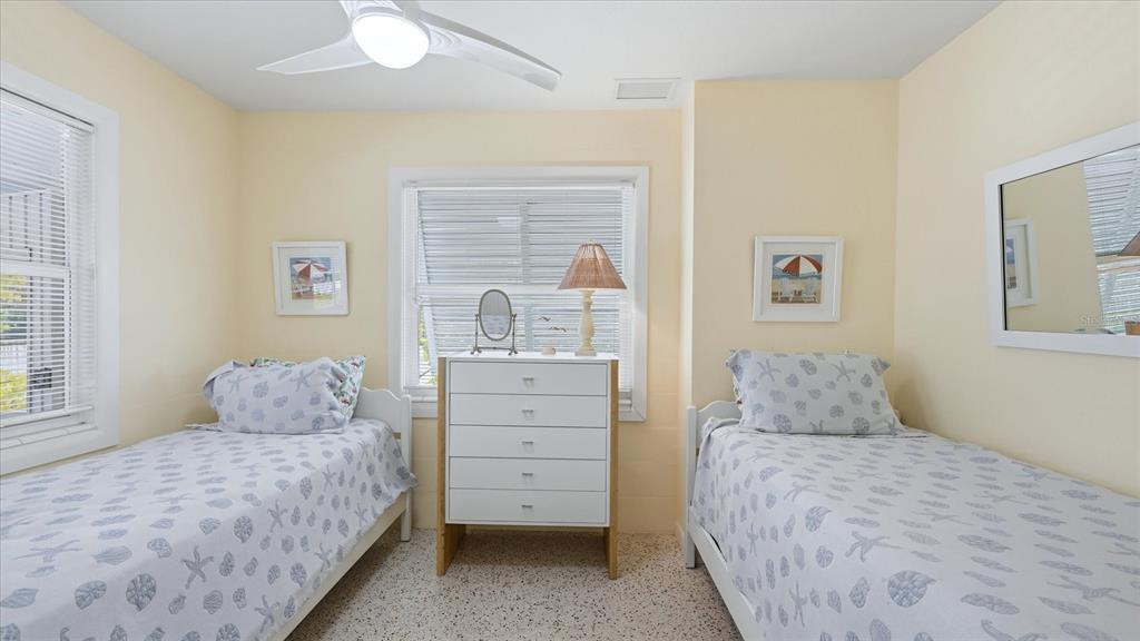 201 Wheeler Road Boca Grande, FL 33921 - Photo 16 of 26 a bedroom with a bed and a window