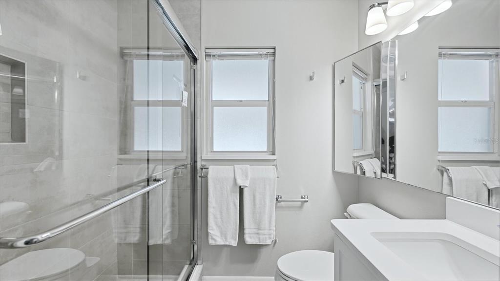 201 Wheeler Road Boca Grande, FL 33921 - Photo 18 of 26 a bathroom with a toilet sink and shower