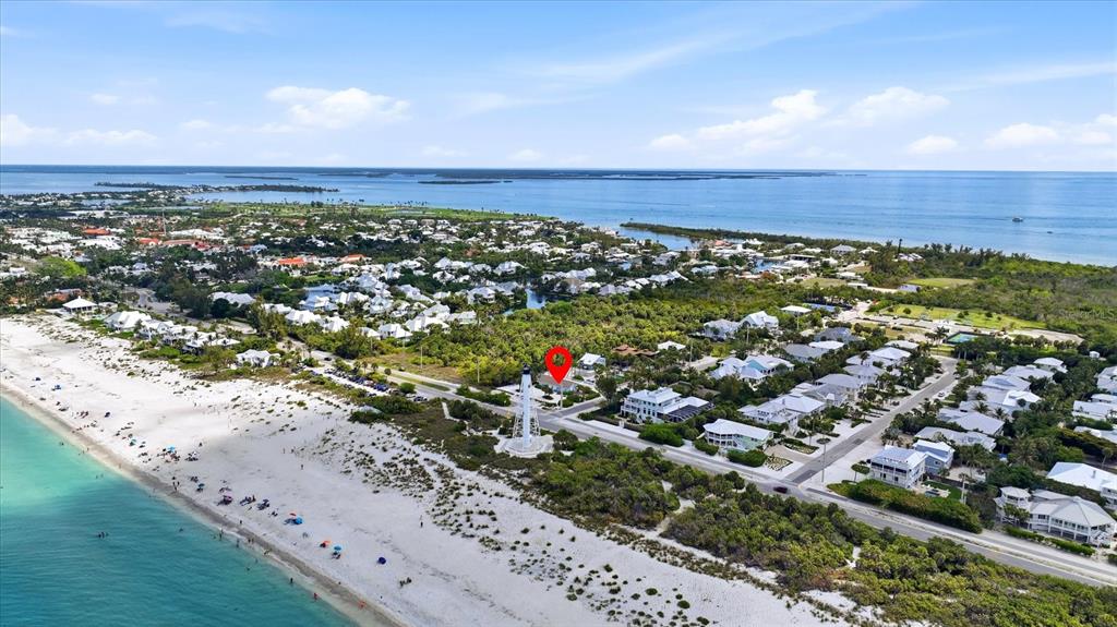 201 Wheeler Road Boca Grande, FL 33921 - Photo 2 of 26 an aerial view of a houses with a yard and lake view
