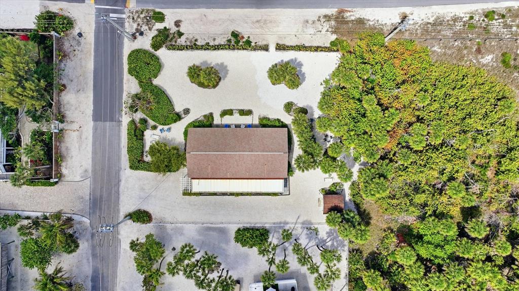 201 Wheeler Road Boca Grande, FL 33921 - Photo 22 of 26 an aerial view of a house with a yard and sitting area