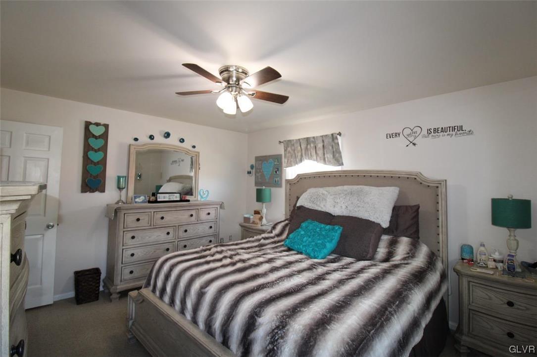 472 Georgetown Road Nazareth, PA 18064 - Photo 15 of 30 a bedroom with a bed and a chandelier