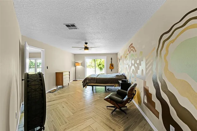 a view of a livingroom with furniture and a window