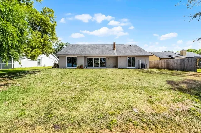 a large white house with a large pool