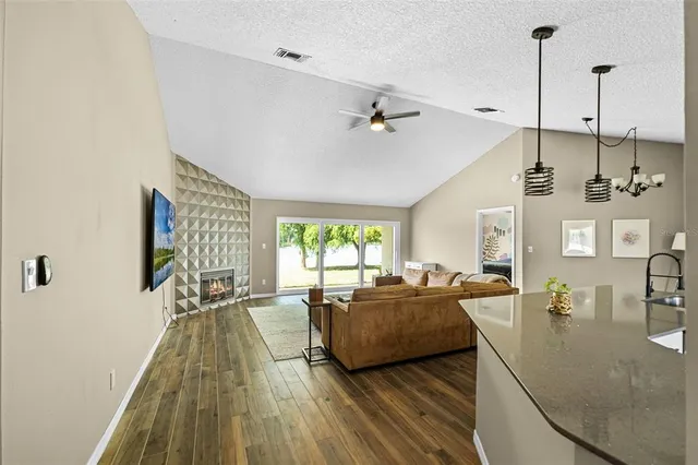 a living room with furniture and a large window