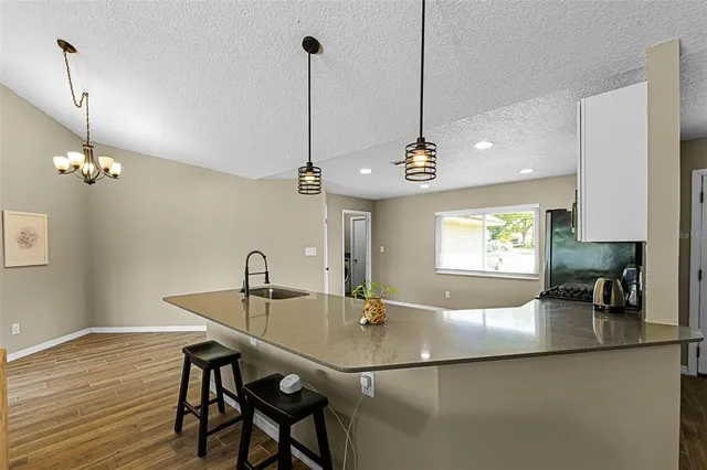 a view of a dining room and a table or chandelier