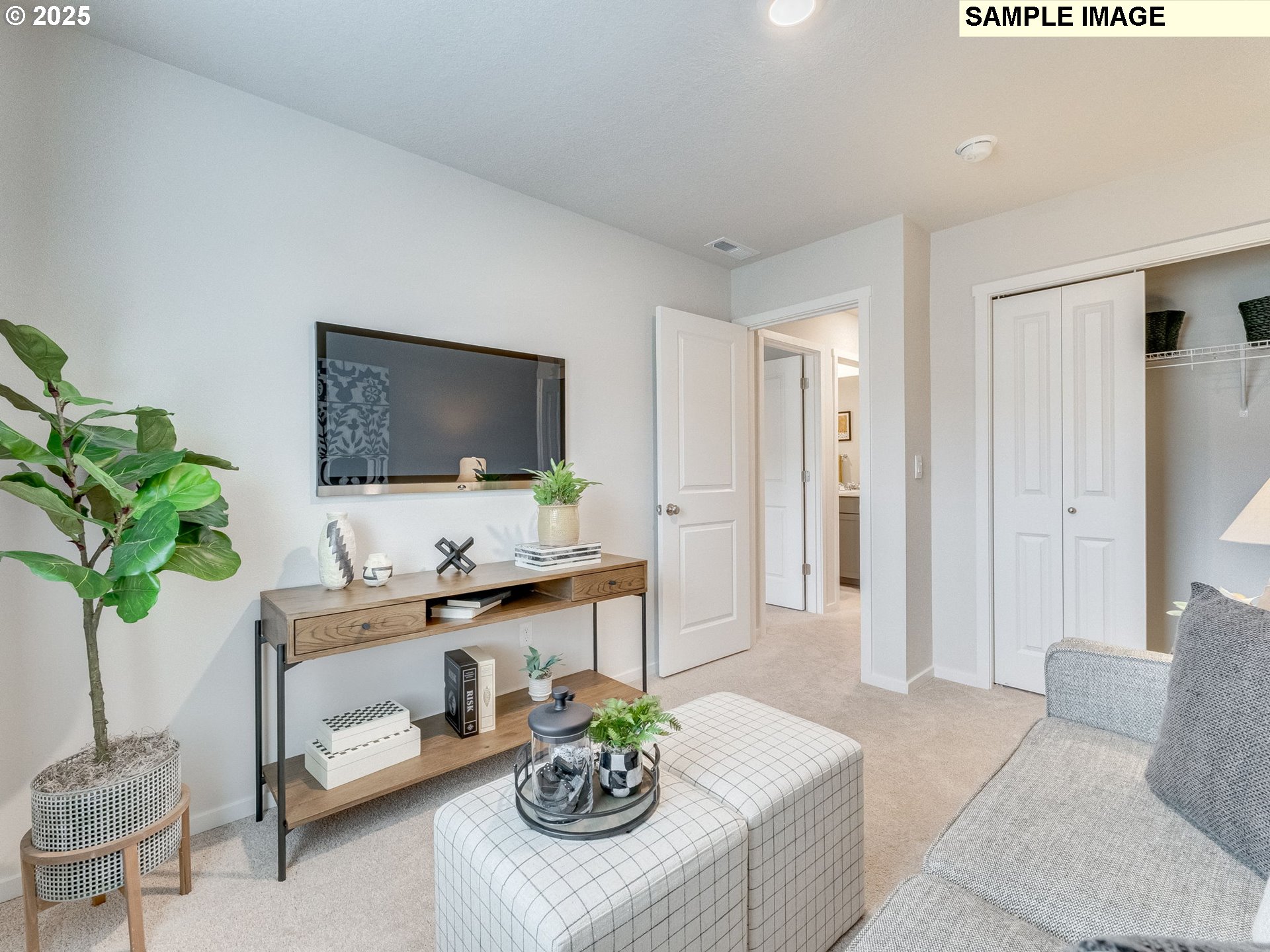 1107 Southeast 193rd Place Camas, WA 98607 - Photo 17 of 31 a living room with furniture potted plant and a flat screen tv