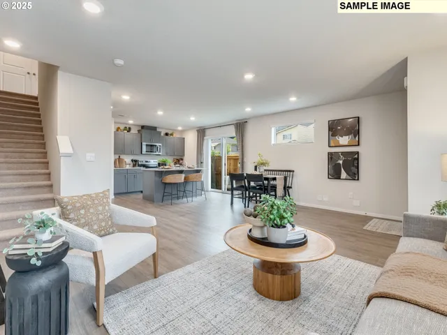 a living room with furniture and a table