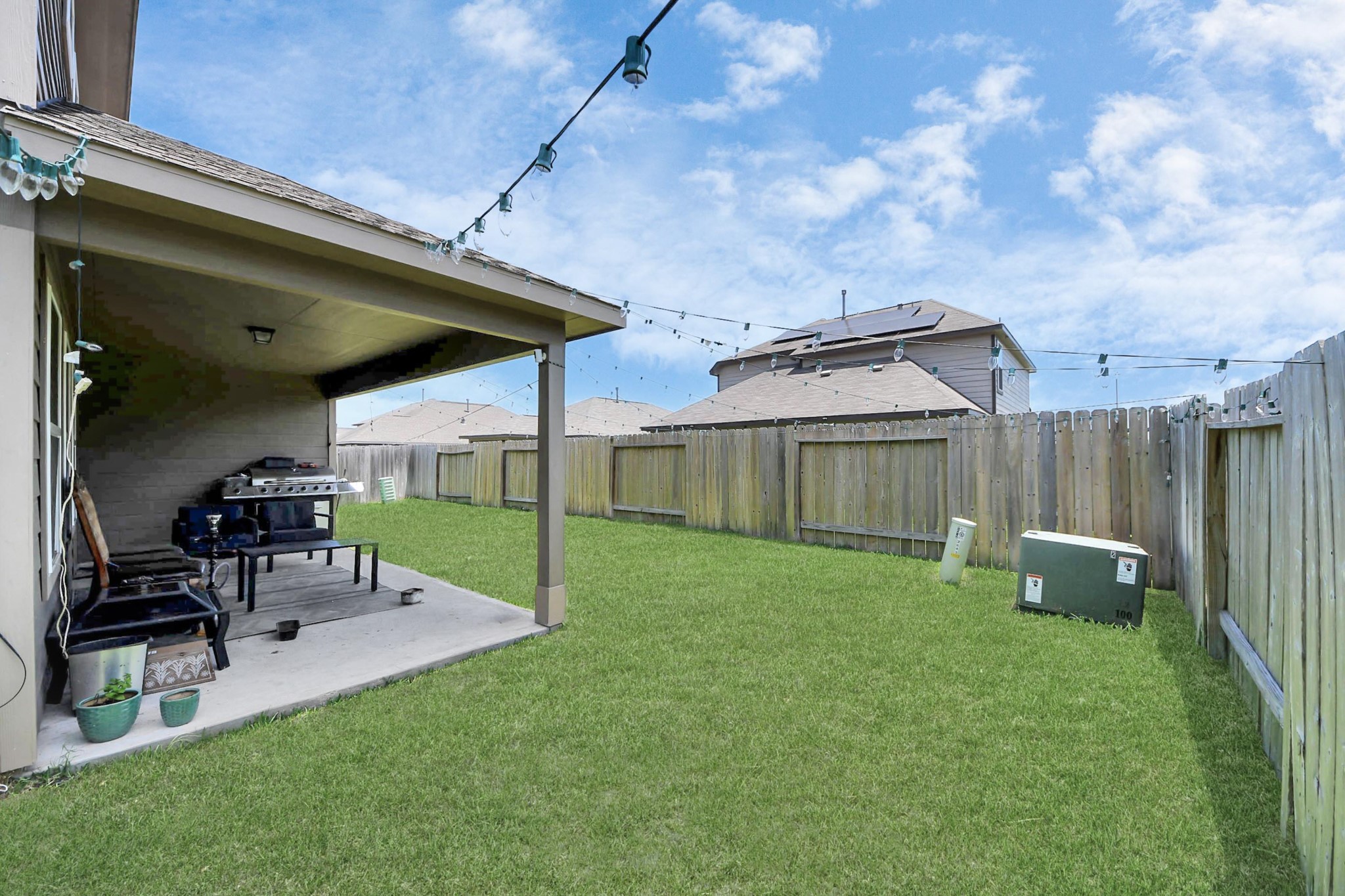 2643 Ridgeback Drive Rosenberg, TX 77471 - Photo 38 of 46 a view of backyard with table and chairs and potted plants