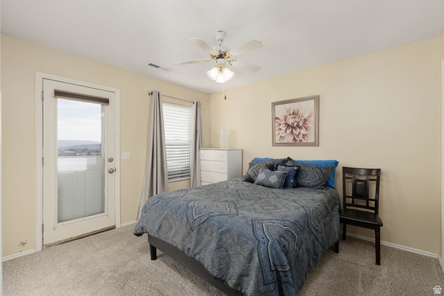 161 West 950 South, Unit S4 St. George, UT 84770 - Photo 10 of 21 Bedroom with access to exterior, light carpet, and ceiling fan