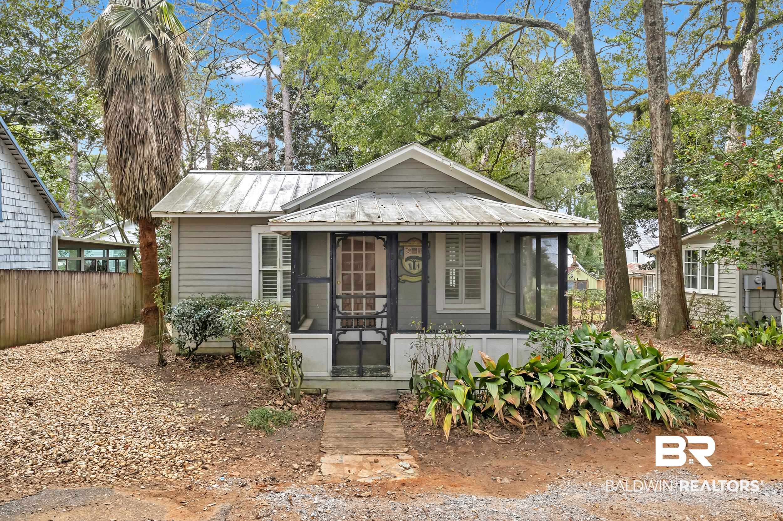55 Boise Lane Fairhope, AL 36532 - Photo 4 of 24 Bungalow featuring a screened porch, metal roof, and partially fenced
