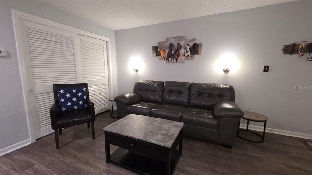 3200 River Ranch Boulevard, Unit 303 River Ranch, FL 33867 - Photo 6 of 16 a living room with furniture