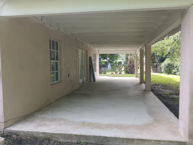 a kitchen with a sink a stove and a microwave