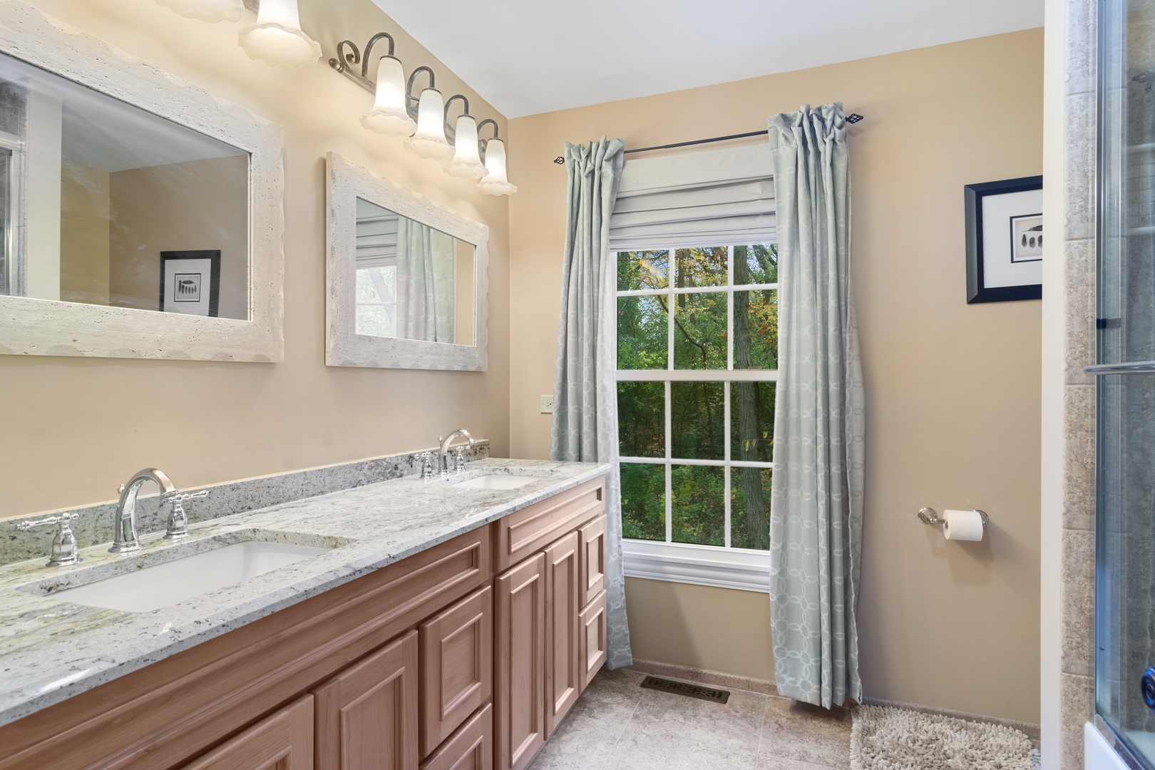 21361 West Brandon Road Kildeer, IL 60047 - Photo 27 of 30 a bathroom with a granite countertop sink and a window