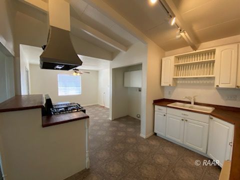 301 North Florence Street Ridgecrest, CA 93555 - Photo 8 of 33 a kitchen with granite countertop white cabinets and white appliances