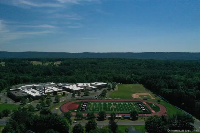 an aerial view of a house with pool garden