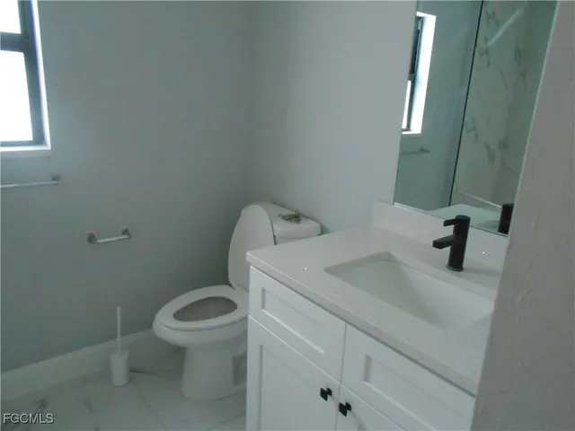 a bathroom with a sink and a toilet
