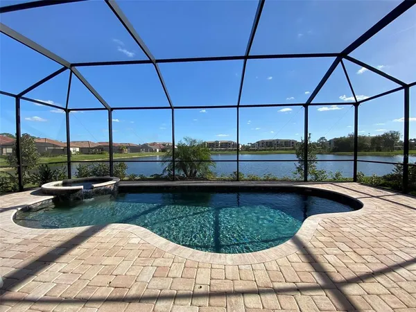 a bedroom with a large bed and a flat screen tv