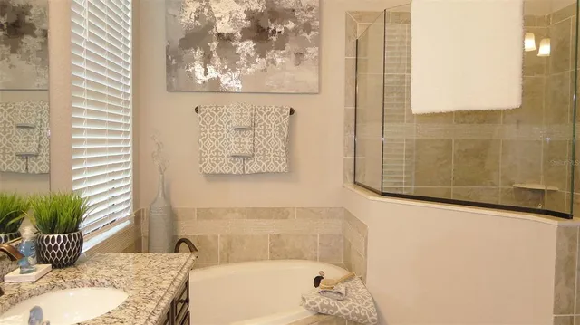 a bedroom with a bed and hallway