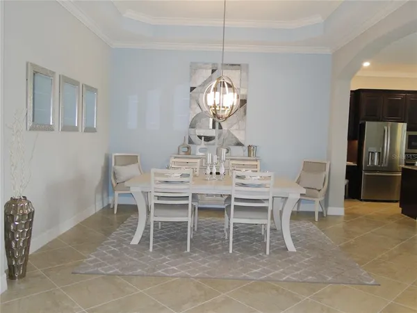 a view of a dining room and wooden floor