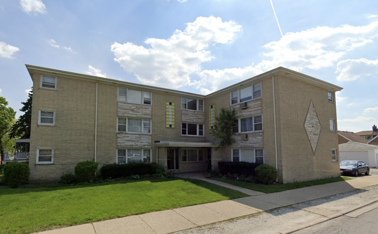 3556 North Nagle Avenue, Unit 2W Chicago, IL 60634 - Photo 1 of 14 a view of house with yard