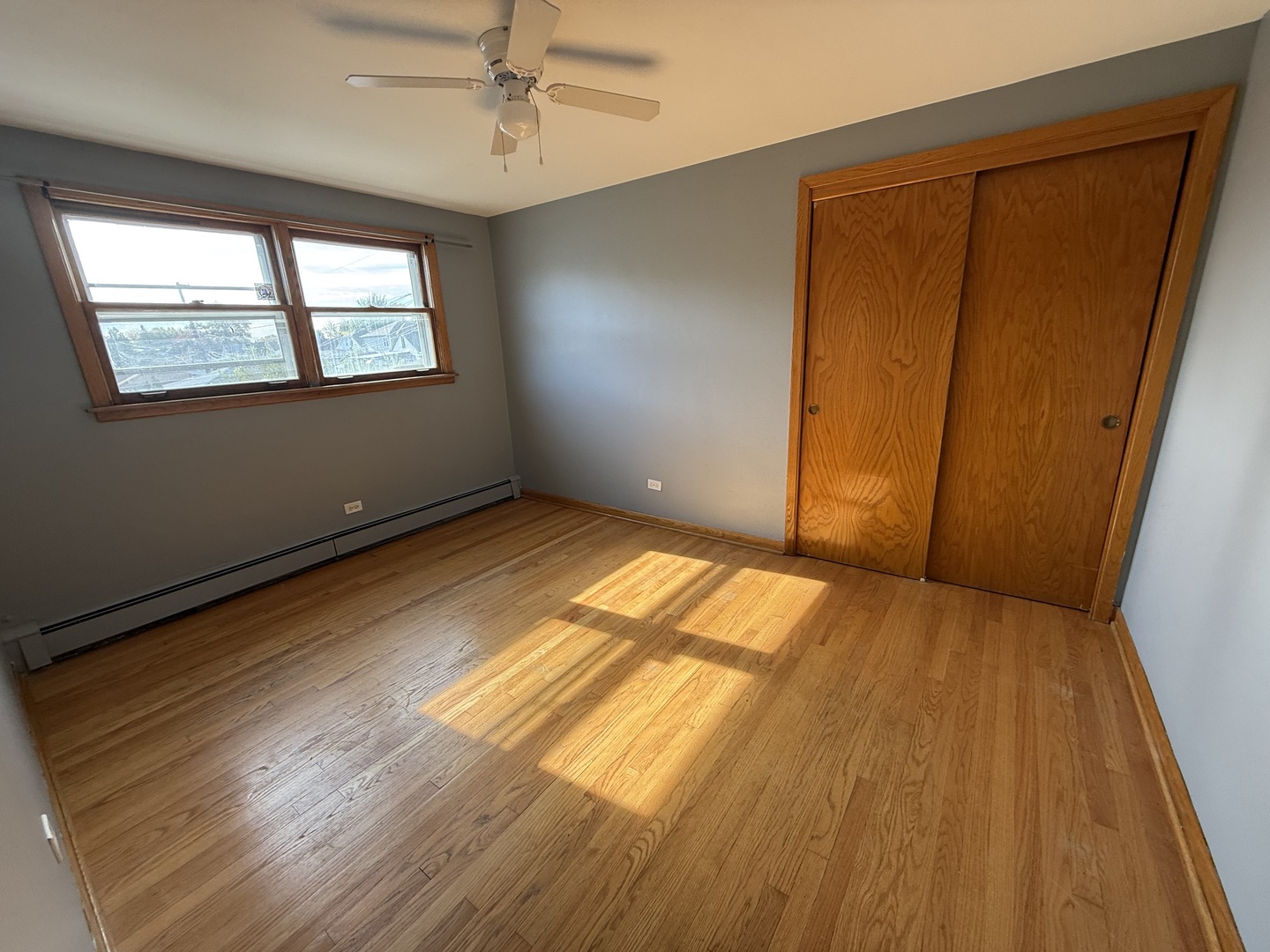 3556 North Nagle Avenue, Unit 2W Chicago, IL 60634 - Photo 12 of 14 a view of an empty room and wooden floor