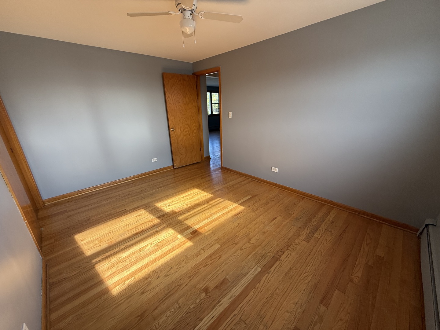 3556 North Nagle Avenue, Unit 2W Chicago, IL 60634 - Photo 13 of 14 wooden floor in an empty room