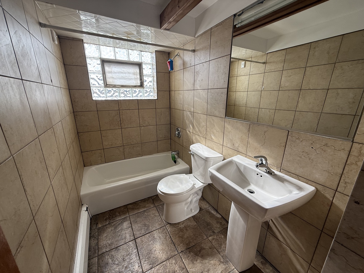 3556 North Nagle Avenue, Unit 2W Chicago, IL 60634 - Photo 14 of 14 a bathroom with a sink toilet and shower
