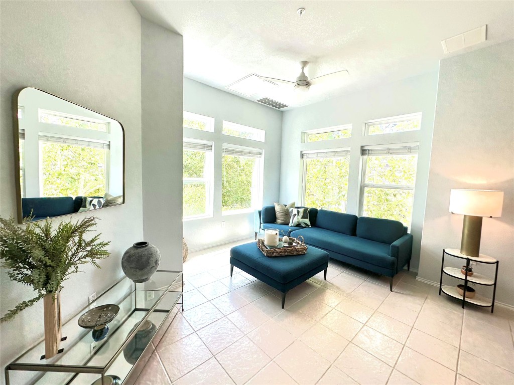 4323 Nitschke Street Austin, TX 78723 - Photo 3 of 11 a living room with furniture and a large window