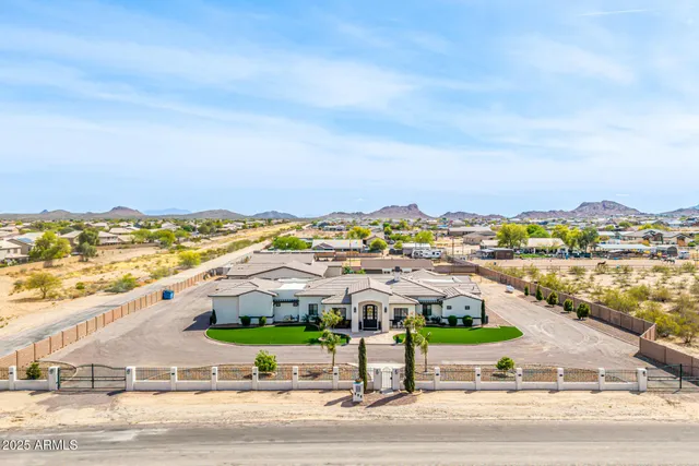 an aerial view of residential building and ocean view