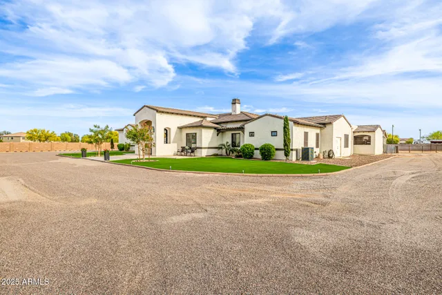 a bathroom with a granite countertop toilet sink and a shower