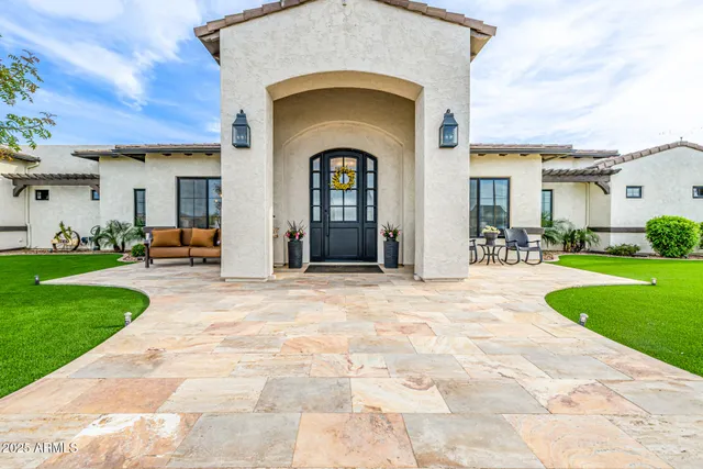 a kitchen with kitchen island a sink stainless steel appliances and kitchen island
