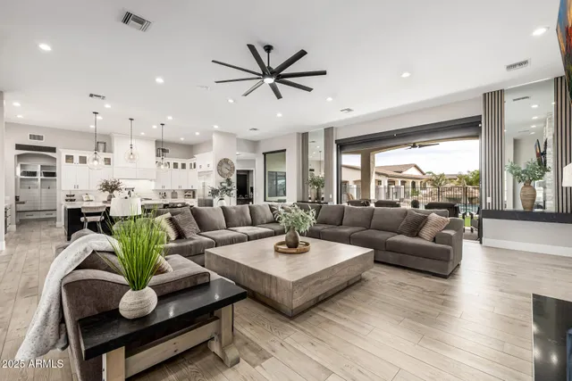 a bathroom with double vanity and a mirror