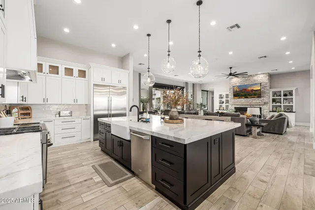 a view of a hall with wooden floor and windows