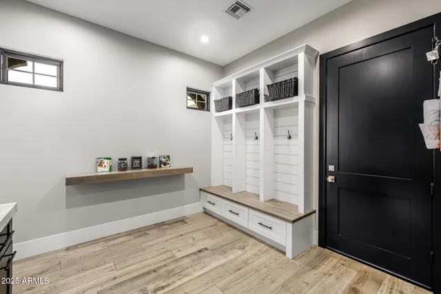 a bathroom with a granite countertop sink and a window