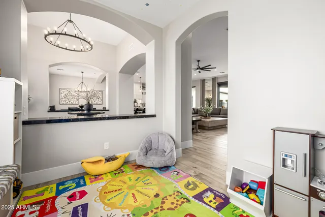a view of a dining room with furniture and a rug