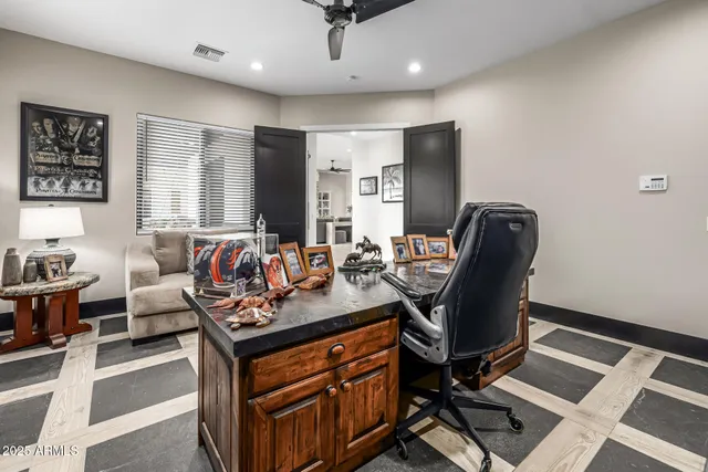 an aerial view of residential houses with outdoor space and ocean view