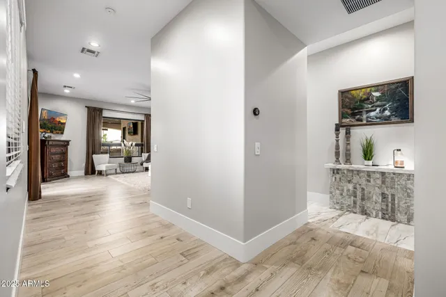 a view of a patio with table and chairs with wooden floor and fence